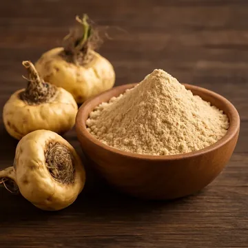 Maca roots beside a bowl of maca powder